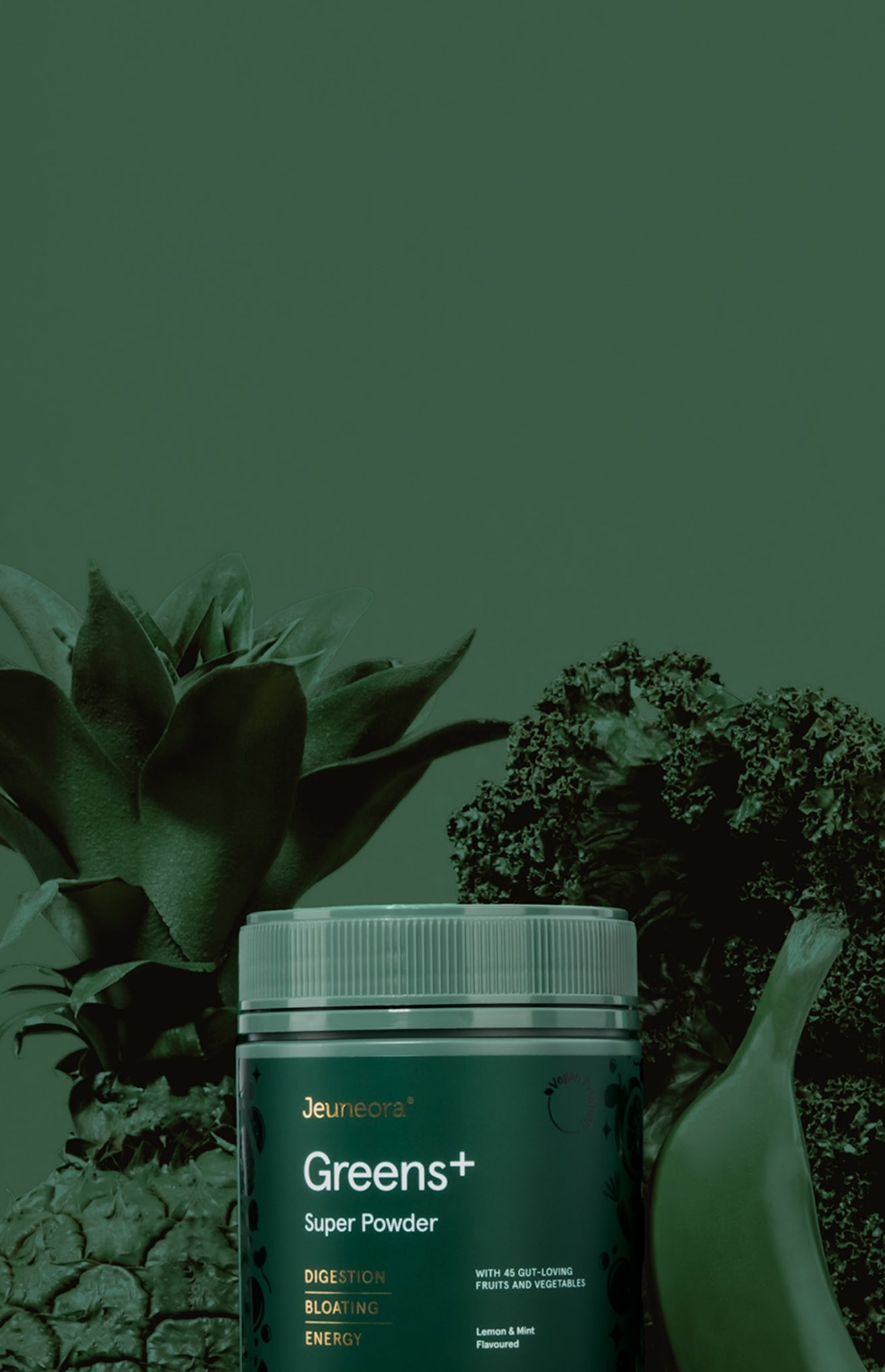 A container of Greens super powder with fruits and vegetables that have been painted green like the background of the image