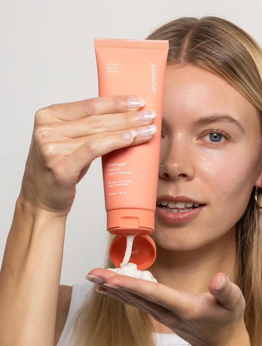 women squeezing Sowhippy cleanser from tube onto her hand